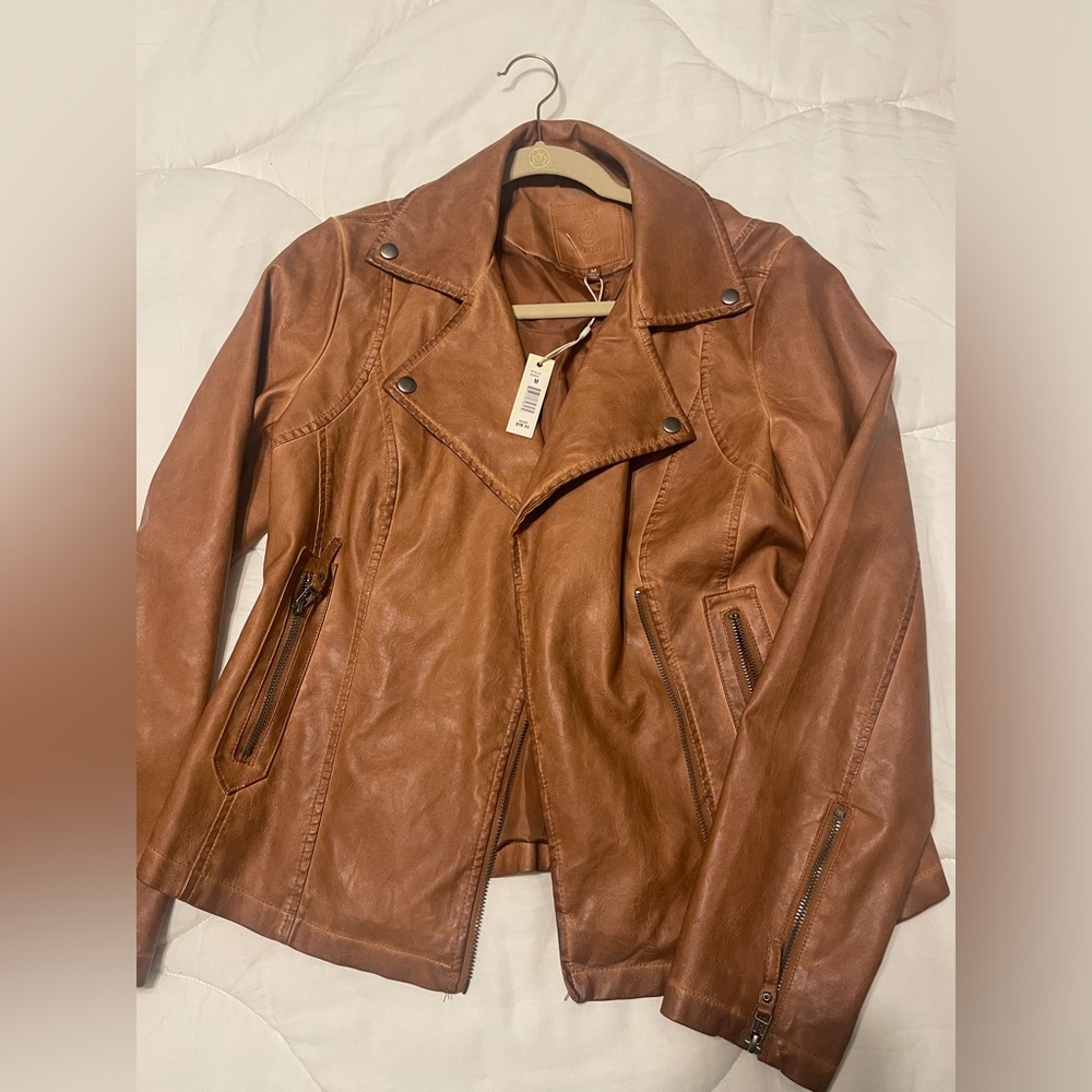 Brown leather jacket. Never worn, size medium!